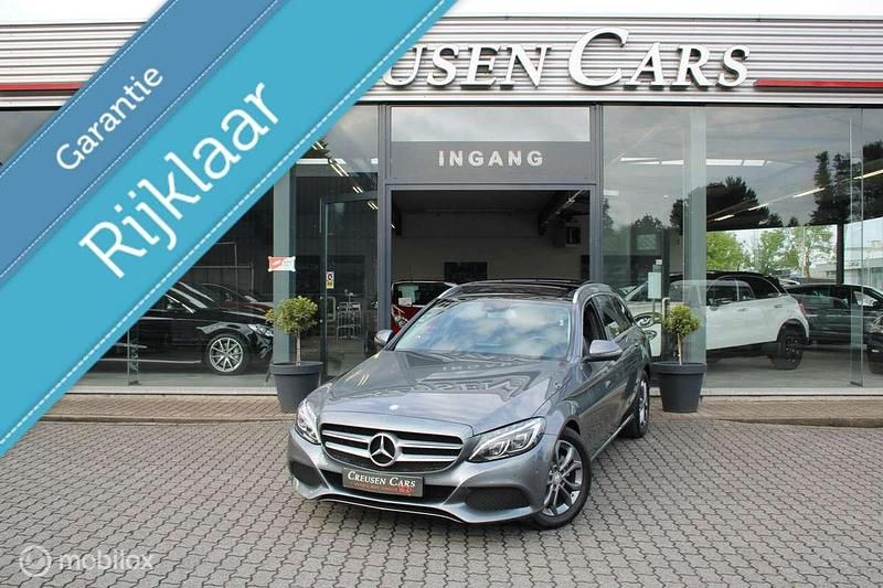 , metallic lak Gebruikt 2016 Mercedes C180 Prestige Stationwagen | € 22.500 (Duur) - Afbeelding 1/4