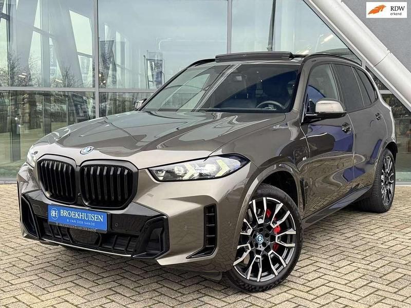 Groen (metallic) Gebruikt 2024 BMW X5 M Sport SUV | € 93.950 (Eerlijke prijs) - Afbeelding 1/4