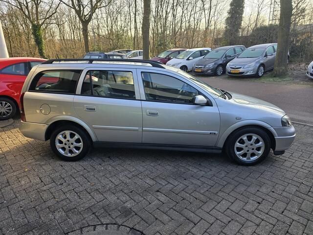 Occasion Opel Astra Njoy 84 PK (61 kW) 2003 Grijs, metallic lak Stationwagen