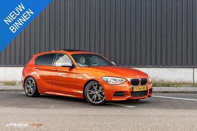 Oranje Occasion 2013 BMW M135 Executive Hatchback | € 19.950 (Duur) - Afbeelding 1/4