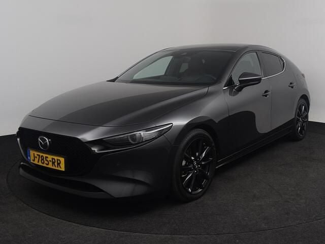 Machine gray (grijs metallic) Gebruikt 2020 Mazda 3 Luxury Hatchback | € 22.750 (Eerlijke prijs) - Afbeelding 1/4