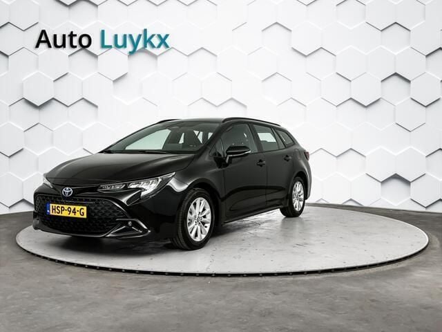 Zwart Nieuw 2024 Toyota Corolla Hybrid Active Stationwagen | € 33.940 (Goede deal) - Afbeelding 1/4