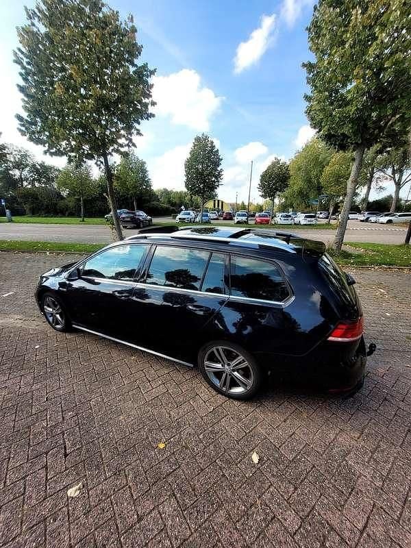 Zwart Gebruikt 2017 VW Golf VII Highline Stationwagen | € 16.750 (Eerlijke prijs) - Afbeelding 1/4
