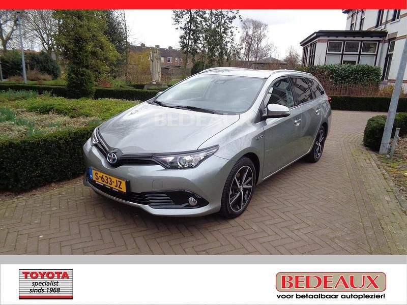 Grijs (metallic) Occasion 2018 Toyota Auris Hybrid Edition Stationwagen | € 17.950 (Eerlijke prijs) - Afbeelding 1/4
