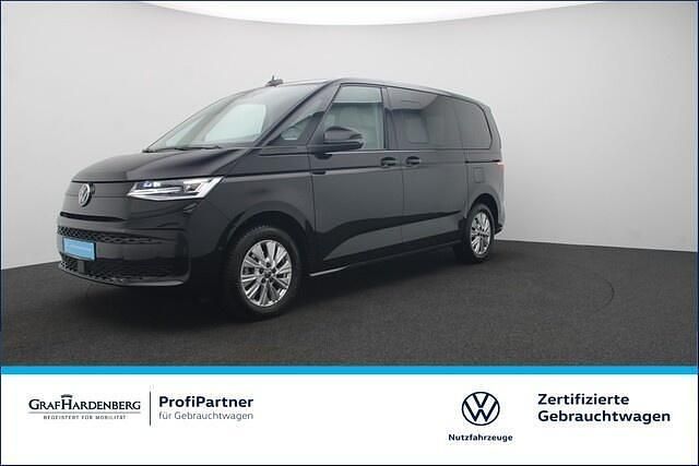 Zwart Gebruikt 2023 VW Multivan Basis Van | € 53.095 - Afbeelding 1/4