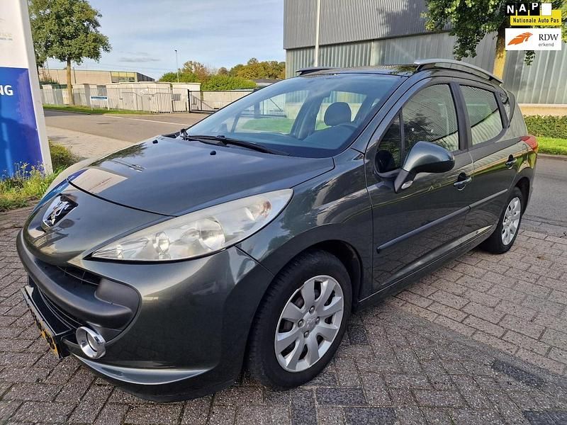 Grijs (metallic) Gebruikt 2007 Peugeot 207 Stationwagen | € 1.299 (Goede deal) - Afbeelding 1/4
