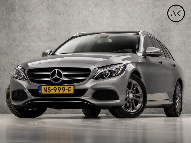 Grijs Gebruikt 2016 Mercedes C180 AMG Stationwagen | € 19.445 (Goede deal) - Afbeelding 1/4