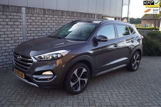 Bruin, metallic lak Gebruikt 2018 Hyundai Tucson Premium SUV | € 23.650 (Eerlijke prijs) - Afbeelding 1/4