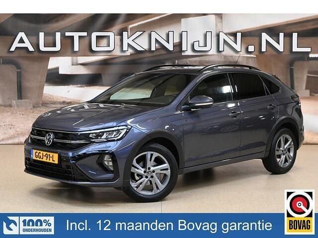 Grijs (metallic) Gebruikt 2024 VW Taigo R-line SUV | € 27.895 (Goede deal) - Afbeelding 1/4