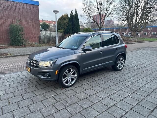 Grijs (metallic) Occasion 2012 VW Tiguan Sport SUV | € 5.900 (Super prijs) - Afbeelding 1/4