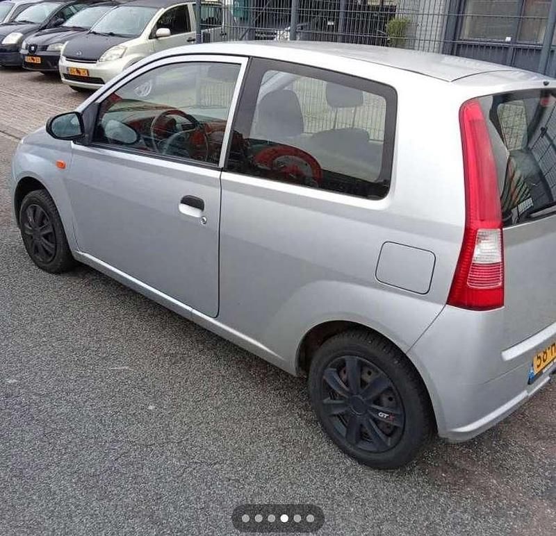 Occasion Daihatsu Cuore 58 PK (42 kW) 2008 Zilver Hatchback