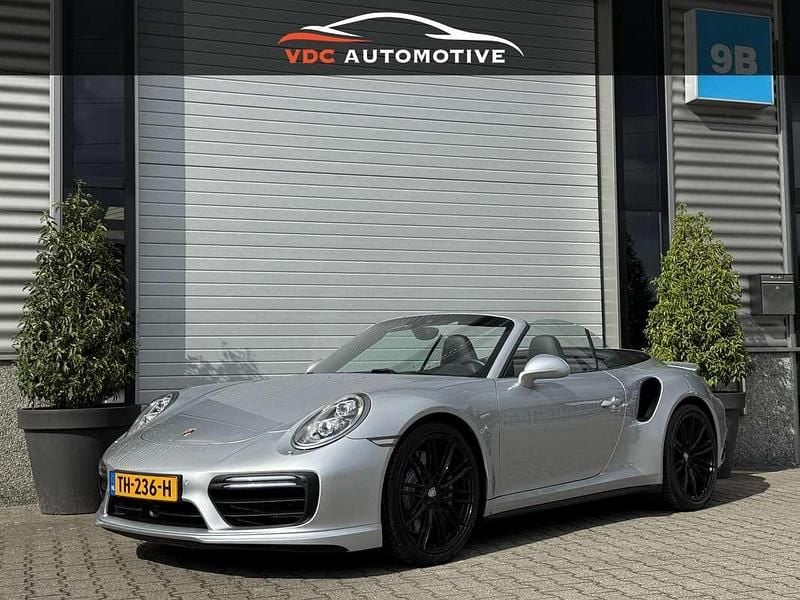Grijs, metallic lak Gebruikt 2016 Porsche 991 Cabriolet | € 119.991 - Afbeelding 1/4