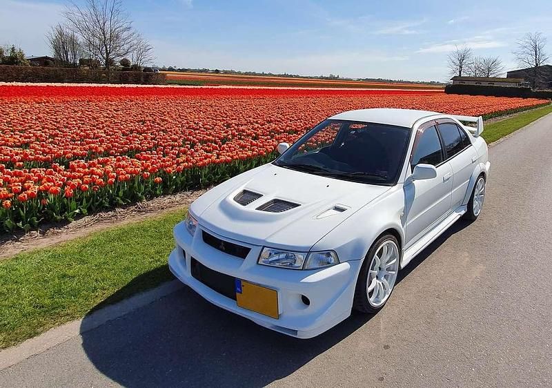 Wit Gebruikt 1999 Mitsubishi Lancer Sedan | € 32.500 - Afbeelding 1/4