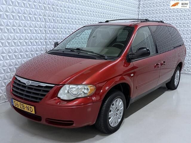 Rood (metallic) Occasion 2006 Chrysler Grand Voyager MPV | € 3.999 (Eerlijke prijs) - Afbeelding 1/4