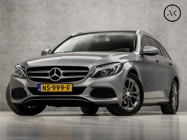Grijs Gebruikt 2016 Mercedes C180 AMG Stationwagen | € 18.945 (Goede deal) - Afbeelding 1/4