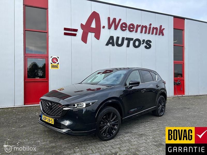 Zwart Gebruikt 2023 Mazda CX-5 Homura-Line SUV | € 36.750 (Eerlijke prijs) - Afbeelding 1/4