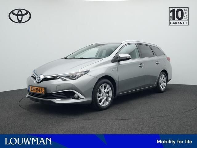 Grijs, metallic lak Gebruikt 2018 Toyota Auris Touring Sports Executive Stationwagen | € 17.680 (Eerlijke prijs) - Afbeelding 1/3