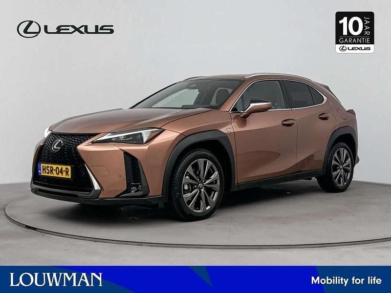 Bruin Gebruikt 2024 Lexus UX 300h Sport Design Packet SUV | € 47.450 - Afbeelding 1/3