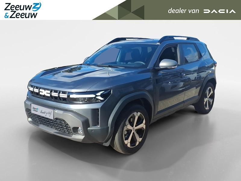Gris schiste Nieuw 2025 Dacia Duster Journey SUV | € 33.765 (Eerlijke prijs) - Afbeelding 1/4