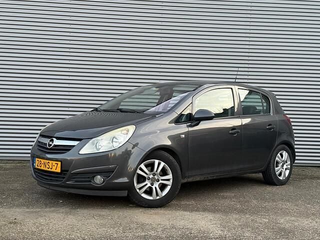 Grijs Occasion 2010 Opel Corsa Cosmo Hatchback | € 1.998 (Iets duurder) - Afbeelding 1/4