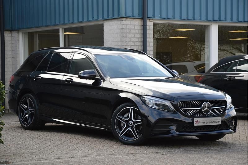 Occasion Mercedes C180 AMG line 157 PK (115 kW) 2021 Zwart Stationwagen