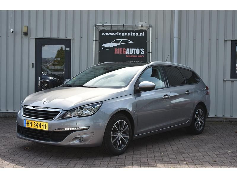 Grijs Gebruikt 2015 Peugeot 308 Stationwagen | € 6.450 (Iets duurder) - Afbeelding 1/4