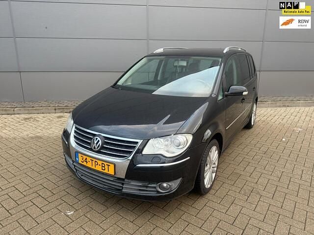 Zwart Gebruikt 2007 VW Touran Highline MPV | € 1.795 (Eerlijke prijs) - Afbeelding 1/4