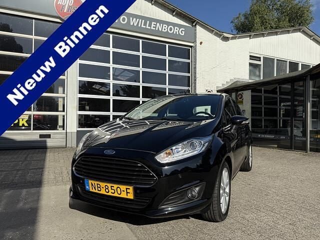 Zwart, metallic lak Gebruikt 2016 Ford Fiesta Titanium Hatchback | € 7.999 (Eerlijke prijs) - Afbeelding 1/4