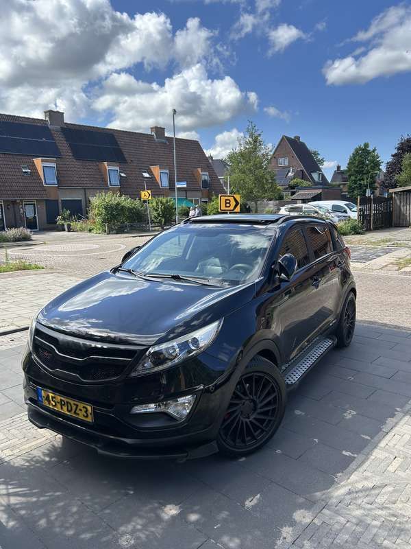Zwart Gebruikt 2011 Kia Sportage Exclusive SUV | € 11.950 (Eerlijke prijs) - Afbeelding 1/4