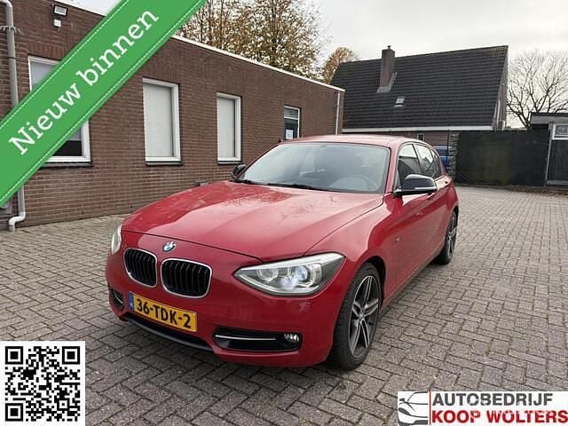 Rood Gebruikt 2012 BMW 116 Sport Line Hatchback | € 4.399 (Goede deal) - Afbeelding 1/4