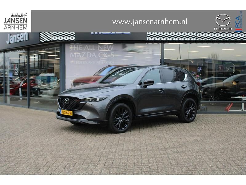 Machine grey (donker grijs) Occasion 2022 Mazda CX-5 Homura-Line SUV | € 36.450 (Iets duurder) - Afbeelding 1/4