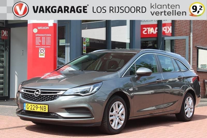 Grijs Gebruikt 2019 Opel Astra Business Stationwagen | € 9.295 (Goede deal) - Afbeelding 1/4