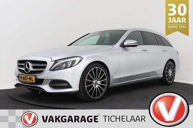 Grijs (metallic) Occasion 2015 Mercedes C200 Prestige Stationwagen | € 19.199 (Iets duurder) - Afbeelding 1/3