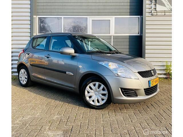 Grijs Gebruikt 2010 Suzuki Swift Exclusive Hatchback | € 3.599 (Goede deal) - Afbeelding 1/4