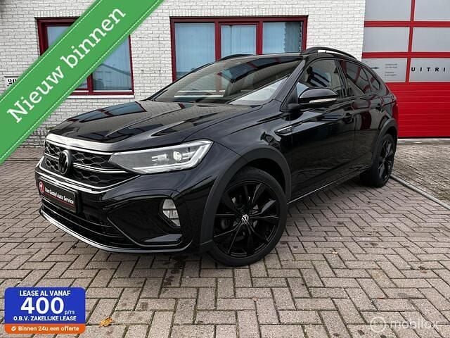 Zwart (metallic) Gebruikt 2022 VW Taigo R-line SUV | € 24.950 (Super prijs) - Afbeelding 1/4