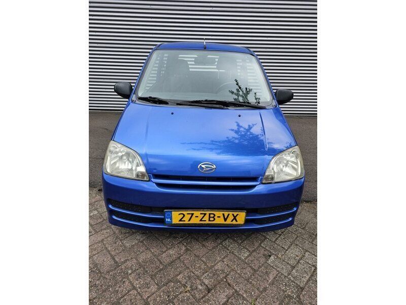Occasion Daihatsu Cuore 59 PK (43 kW) 2008 Blauw, metallic lak Hatchback