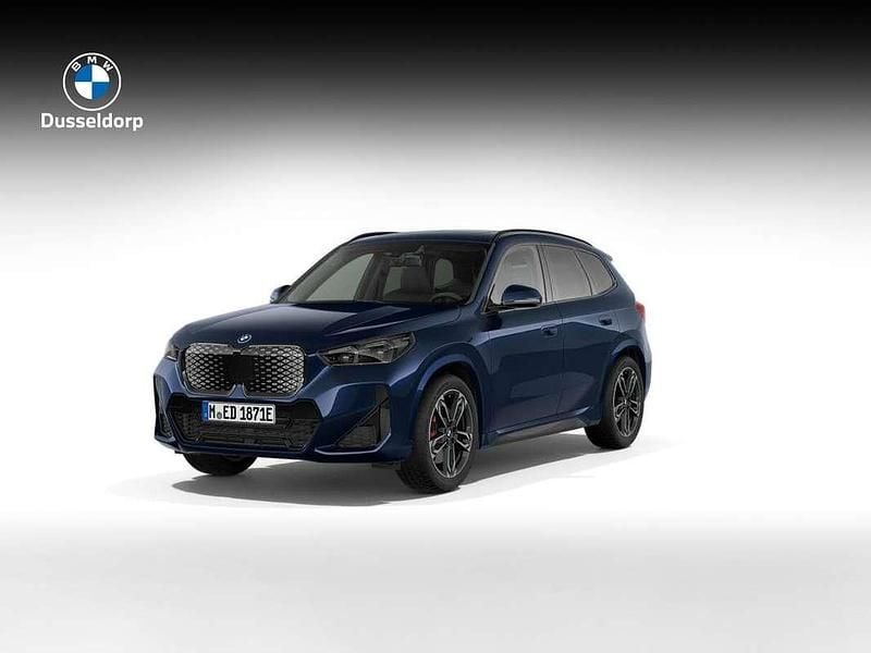 Blauw Nieuw 2025 BMW iX1 M Sport SUV | € 59.724 (Goede deal) - Afbeelding 1/4