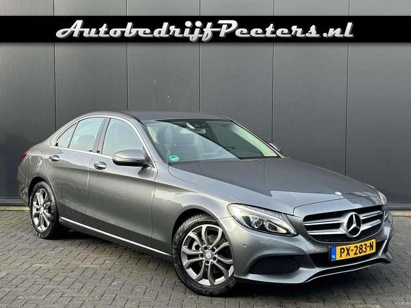 Grijs (metallic) Occasion 2016 Mercedes C180 Sedan | € 19.950 (Goede deal) - Afbeelding 1/4