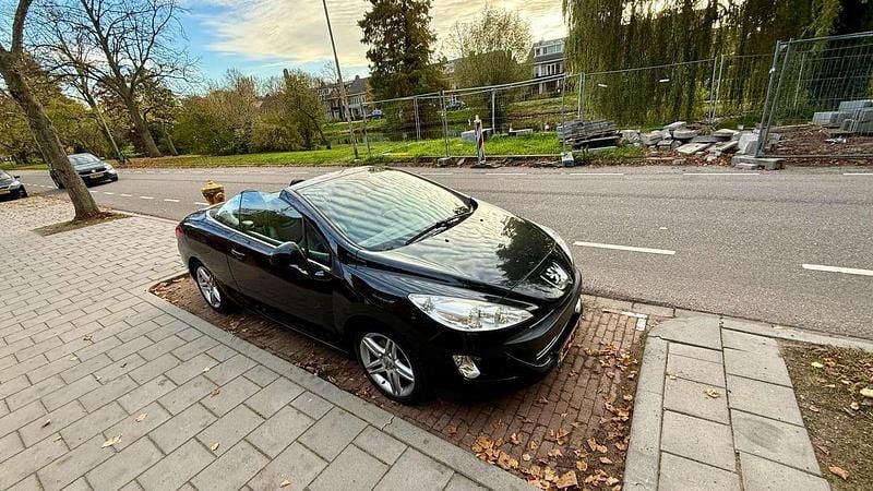 Zwart Gebruikt 2010 Peugeot 308 CC Cabriolet | € 6.000 (Goede deal) - Afbeelding 1/4