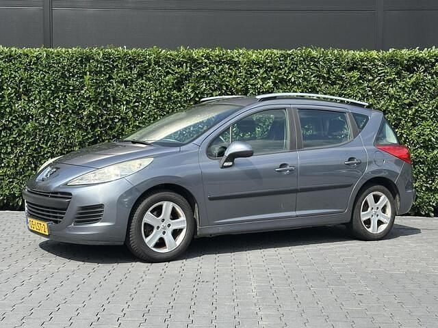 Grijs Gebruikt 2010 Peugeot 207 Style Stationwagen | € 950 (Goede deal) - Afbeelding 1/4