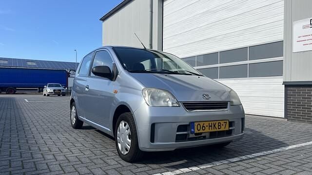 Occasion Daihatsu Cuore 59 PK (43 kW) 2009 Grijs Hatchback