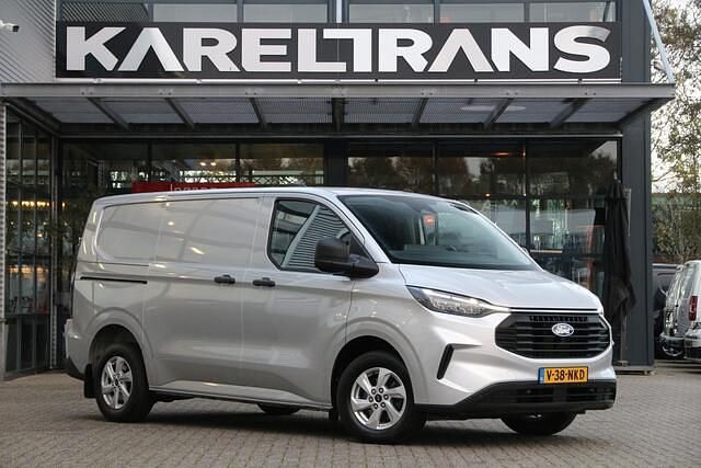 Grijs (metallic) Gebruikt 2024 Ford Transit Custom Van | € 29.950 (Eerlijke prijs) - Afbeelding 1/4