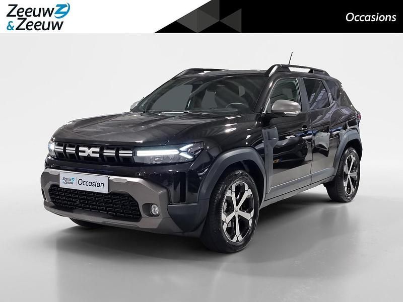 Pearlescent black bc (nv676) Occasion 2025 Dacia Duster Journey SUV | € 27.940 (Goede deal) - Afbeelding 1/4
