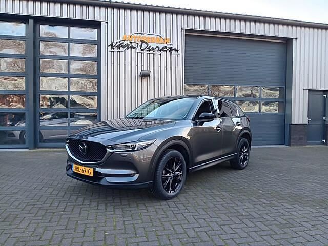 Grijs (metallic) Occasion 2021 Mazda CX-5 Homura-Line SUV | € 30.950 (Eerlijke prijs) - Afbeelding 1/4