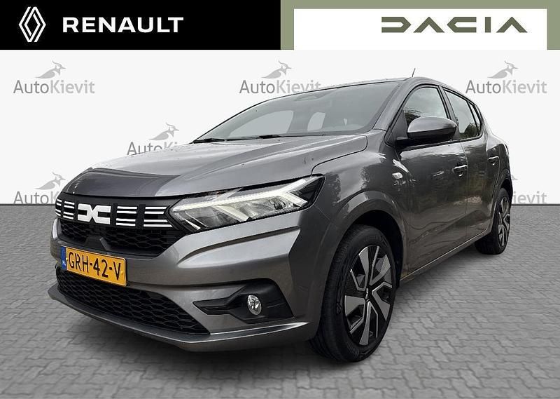 Grijs Gebruikt 2024 Dacia Sandero Expression Hatchback | € 16.950 (Eerlijke prijs) - Afbeelding 1/4