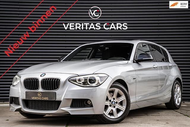 Grijs Gebruikt 2011 BMW 118 Sport Line Hatchback | € 11.950 (Eerlijke prijs) - Afbeelding 1/4