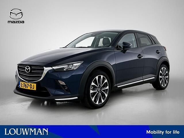 Blauw (metallic) Gebruikt 2021 Mazda CX-3 Luxury SUV | € 21.945 (Eerlijke prijs) - Afbeelding 1/4