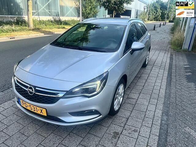 Grijs Gebruikt 2017 Opel Astra Edition Stationwagen | € 2.100 - Afbeelding 1/4
