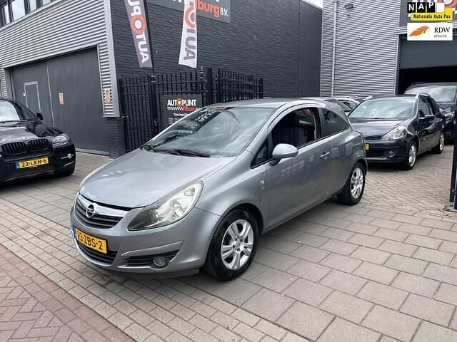 Grijs Gebruikt 2010 Opel Corsa Selection Hatchback | € 2.999 (Goede deal) - Afbeelding 1/4