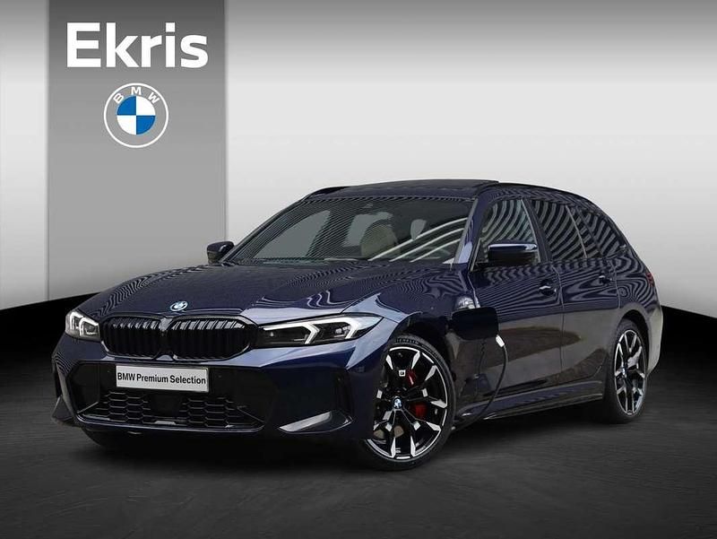 Blauw, metallic lak Gebruikt 2025 BMW 330e Executive Stationwagen | € 75.845 - Afbeelding 1/4
